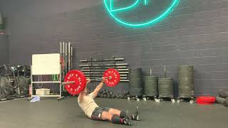 Overhead barbell sit up demonstration